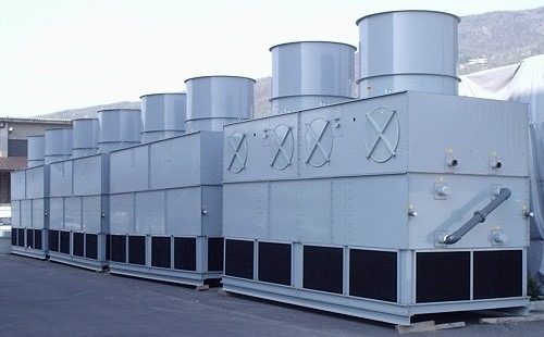 Steam boiler and cooling tower requiring conditioned water